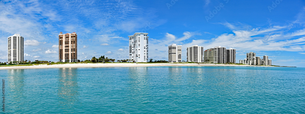A panorama of Singer Island, Florida from the Atlantic Ocean, with a white sandy beach and upscale condos.