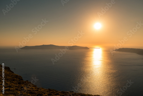 Santorini, Grece - July 23, 2020 - Amazing red sunset over Oia and caldera of the Santorini island, Greece