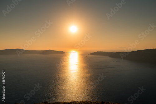 Santorini, Grece - July 23, 2020 - Amazing red sunset over Oia and caldera of the Santorini island, Greece