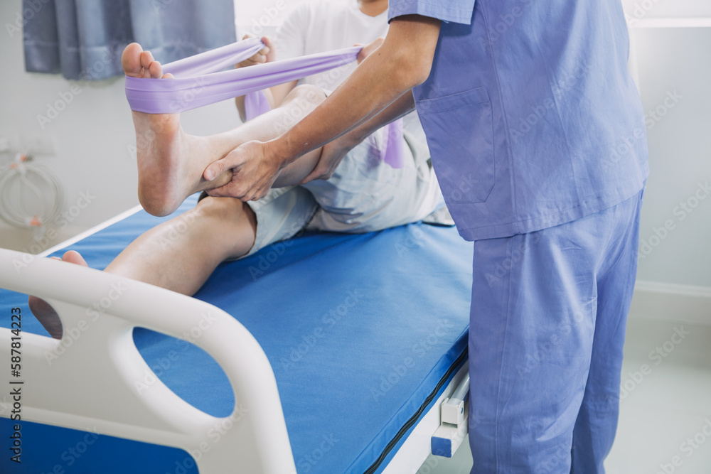 Patient doing some special exercises under supervision in a room Patient doing some special exercises under supervision in a room