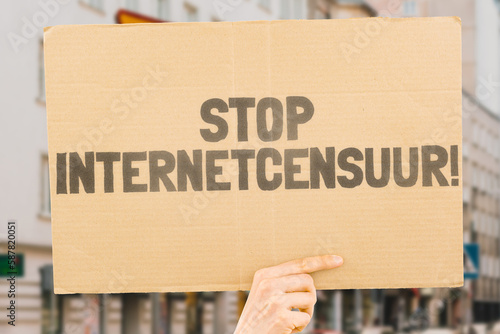 Wallpaper Mural The question " Stop online censorship!" on a banner in men's hands with blurred background. Silence. Regulation. Human rights. Freedom. Free speech. Internet. Network. Violation Torontodigital.ca