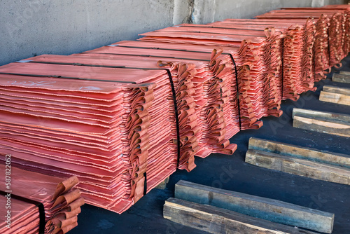 Copper cathodes after fire refining, electrolytic refining and
casting. Copper concentrates produced by mines are sold to smelters and refiners who treat the ore and refine the copper and charge. photo