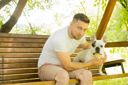 portrait of a man with a dog. man and french bulldog