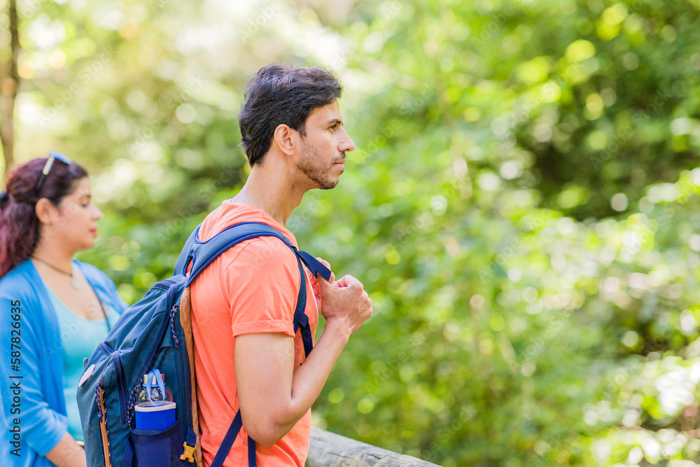 Senda del oso, Teverga Asturias. mixed race travelers couple hiking ecotourism conservation path Senda del oso, Teverga Asturias. mixed race travelers couple hiking ecotourism conservation path