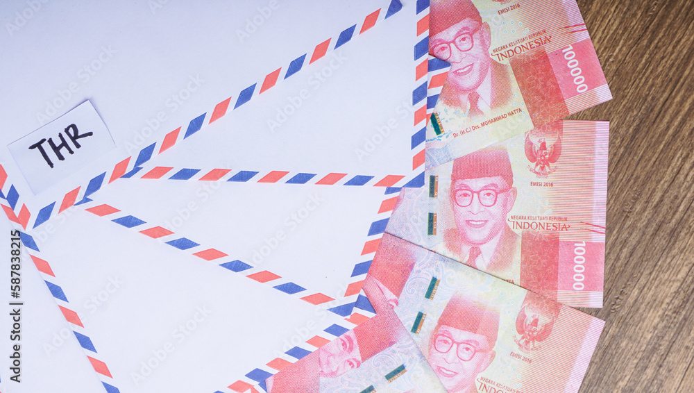 Indonesian money, rupiah/IDR in envelope with THR Text. THR is holiday allowance in Iedul Fitri or Lebaran. Indonesian money, rupiah/IDR in envelope with THR Text. THR is holiday allowance in Iedul Fitri or Lebaran.