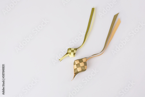 ketupat shape made of ribbon on white background for Ramadan and eid mobarak concept in Indonesia. photo