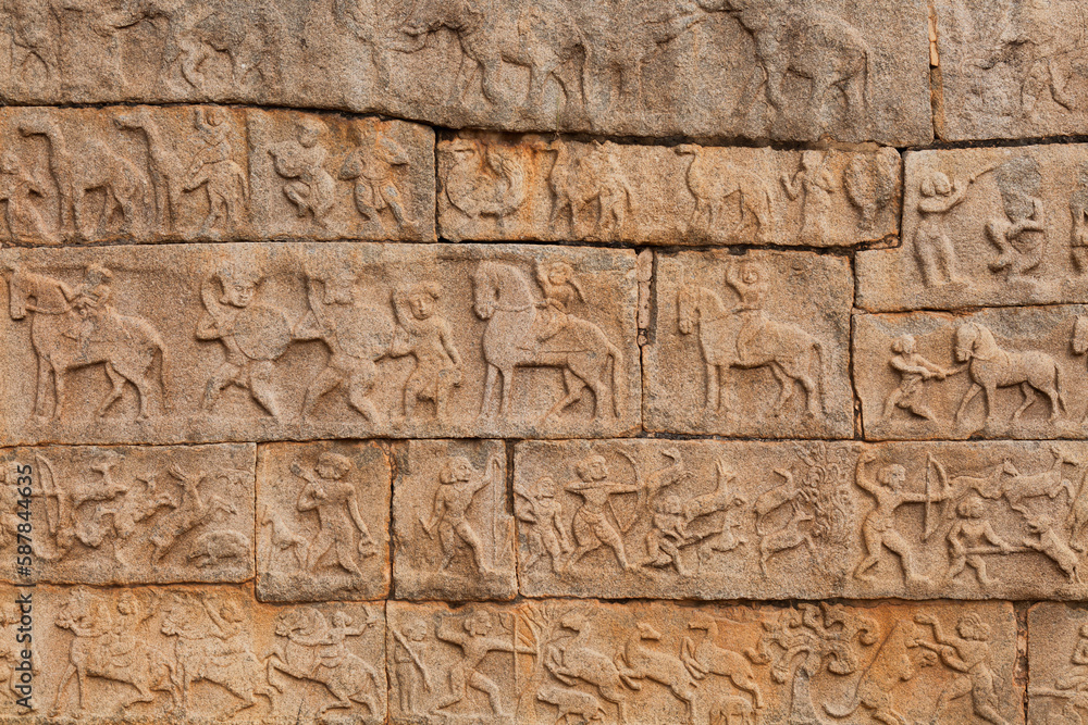 Medieval stone carvings and artwork on the walls of Hazara Rama temple at Hampi, Karnataka, India Medieval stone carvings and artwork on the walls of Hazara Rama temple at Hampi, Karnataka, India