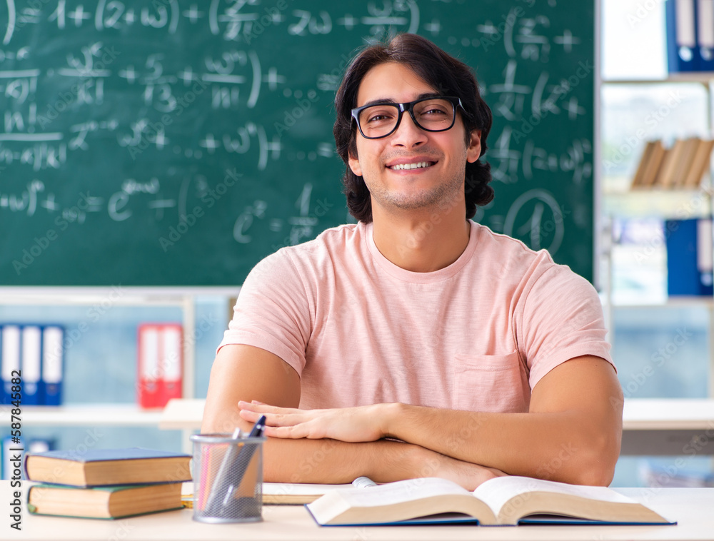 Young male student in the classroom Young male student in the classroom