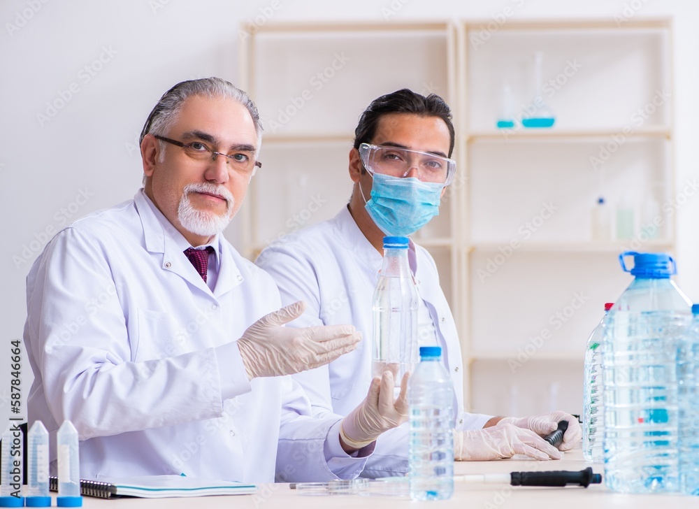 Two chemists working in the lab
