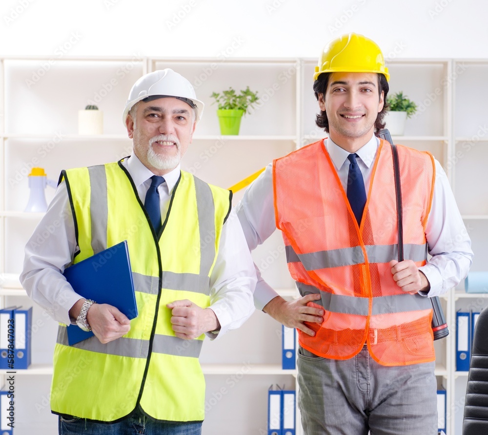 Two engineers colleagues working under project Two engineers colleagues working under project