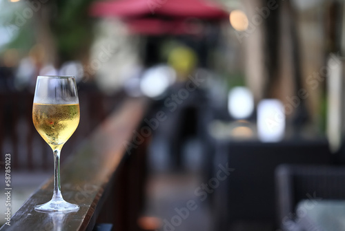 white wine tasting, chilled ice wine in a cold glass in summer