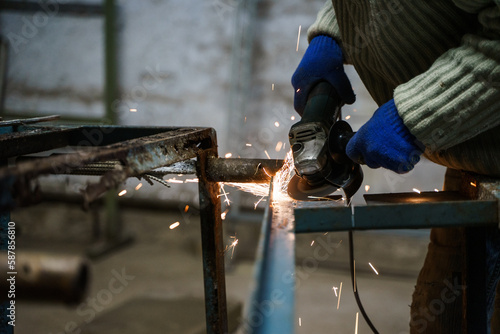 Man at work cutting metal