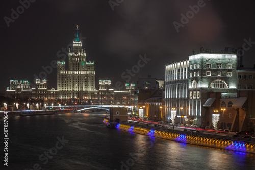 View of the Moscow river, Raushskaya embankment and the skyscraper on Kotelnicheskaya from the Bolshoy Moskvoretsky bridge in Moscow photo