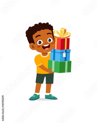 little kid holding stack of present box and walking