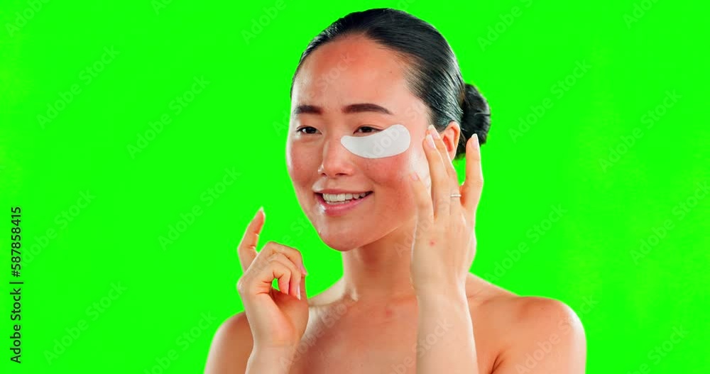 Face, skincare and Asian woman with eye patches on green screen in studio isolated on a background mockup. Dermatology, cosmetics and happy female model apply facial mask for healthy skin treatment. Face, skincare and Asian woman with eye patches on green screen in studio isolated on a background mockup. Dermatology, cosmetics and happy female model apply facial mask for healthy skin treatment.