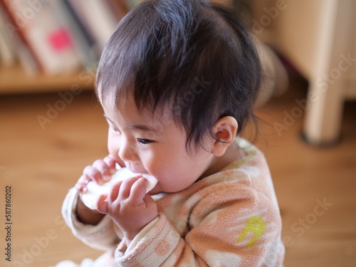 Photo of a 0-Year-Old Girl Enjoying Rice Crackers Snacks
