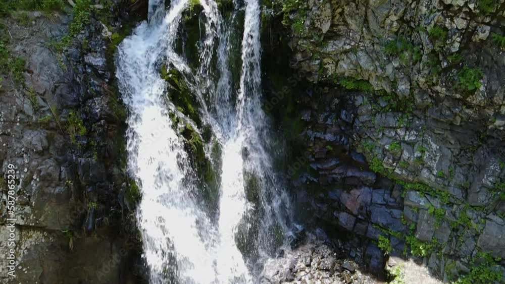 Movement from the bottom of the waterfall to the top. Slow motion Movement from the bottom of the waterfall to the top. Slow motion