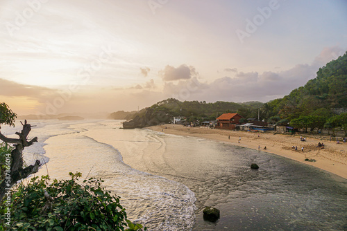 Yogyakarta, Indonesia March 2017 : enjoy view the sunset from the top of indrayanti beach coral hill. photo