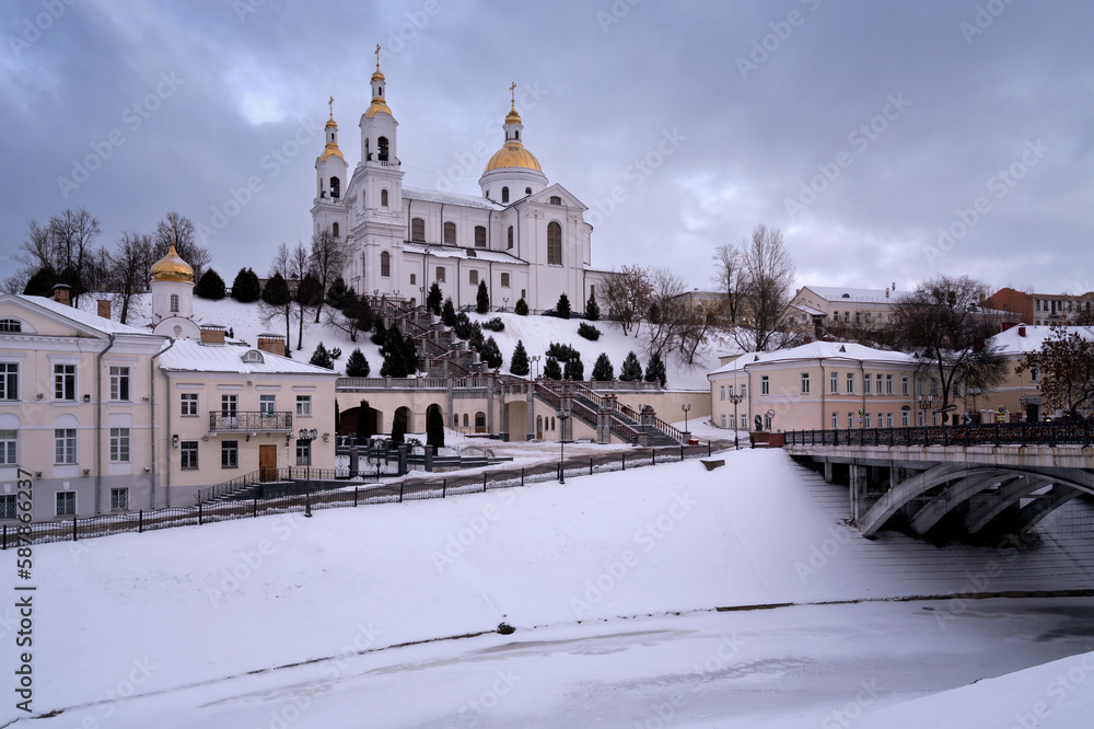 View of the Vitba River embankment, Holy Spirit Convent and Holy Assumption Cathedral on a winter day, Vitebsk, Belarus