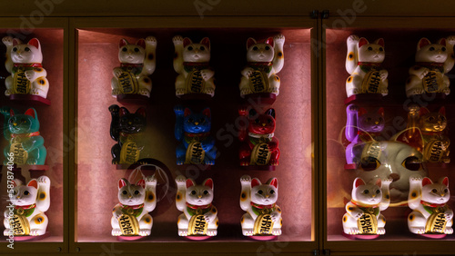 Low key lighting of Maneki neko in Tokyo, Japan.