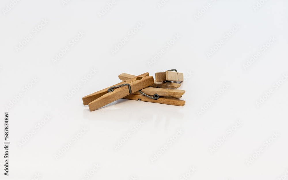 Wooden clothespins isolated on white background. selective focus Wooden clothespins isolated on white background. selective focus