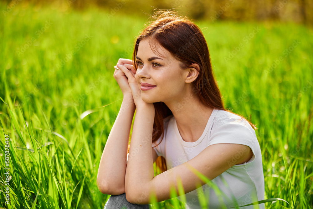 Portrait of young beautiful pensive dreamy woman lying on grass at summer green park . Portrait of young beautiful pensive dreamy woman lying on grass at summer green park .