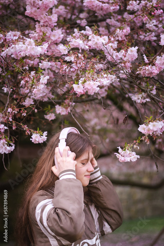 woman in pink cherry blossom