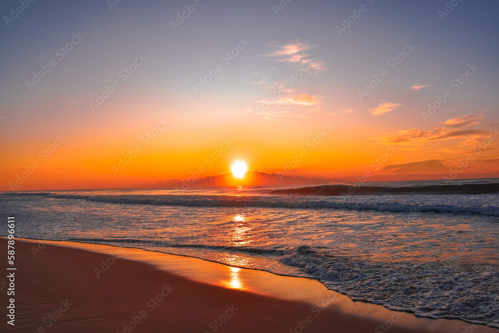 Sunrise on the beach reflection