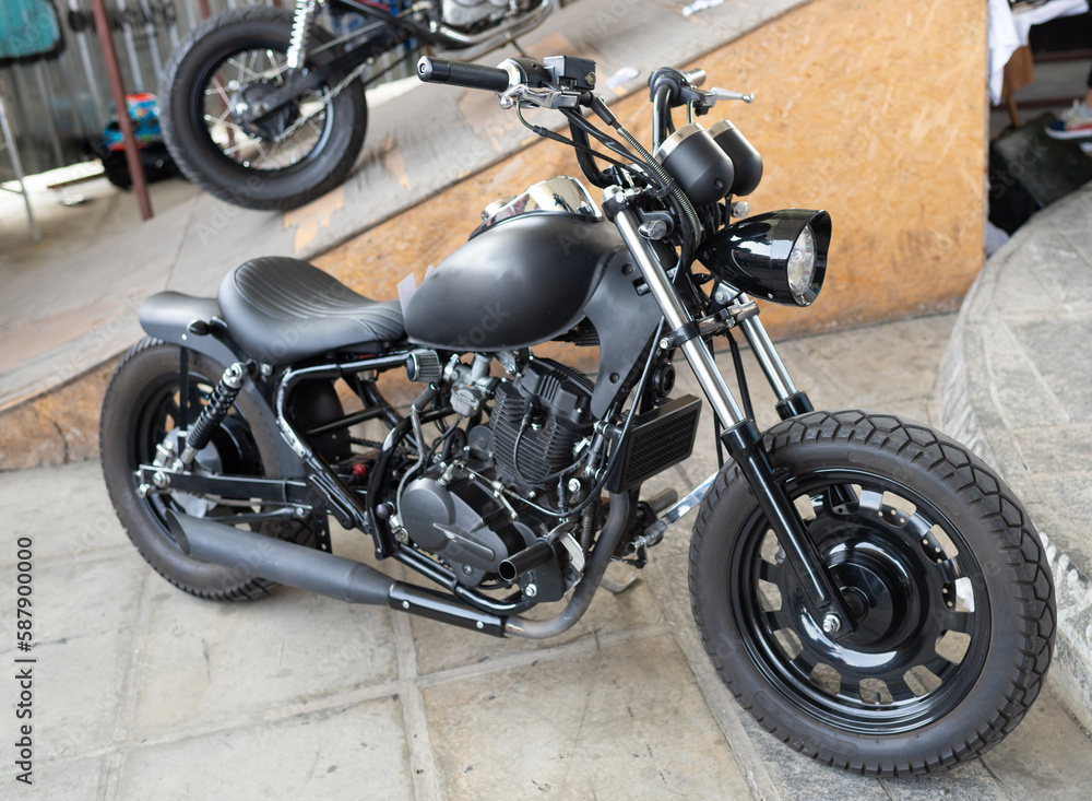 Obraz premium Classic black custombike custom bike motorcycle or bobber vehicle on display