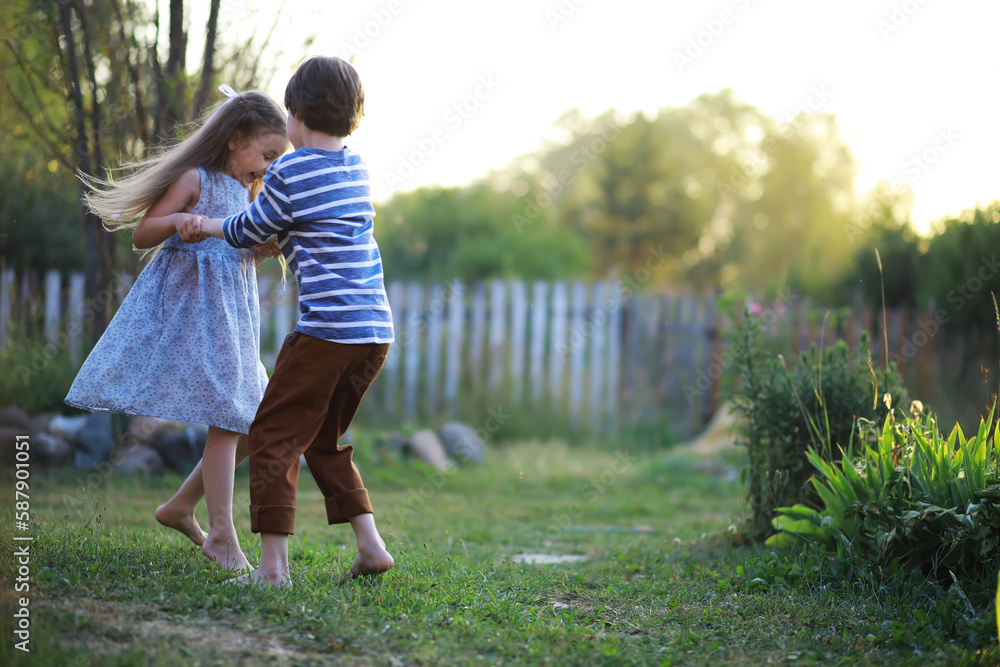 Children walk in the summer in nature. Child on a sunny spring morning in the park. Traveling with children. Children walk in the summer in nature. Child on a sunny spring morning in the park. Traveling with children.