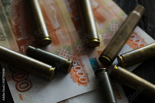 Bullets lie on the russians money money with inscription five thousands rubles top view