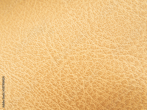 Macro shots, leather or artificial leather surfaces. Brown or golden leather craft pattern. photo