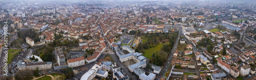 Aerial around the city Bourg-en-Bresse on a cloudy afternoon in early spring in France