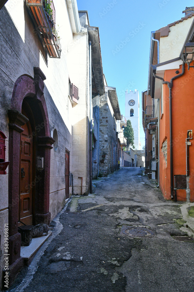 Fototapeta premium A narrow street among the old houses of Torrice, a medieval town in the province of Frosinone in Italy.