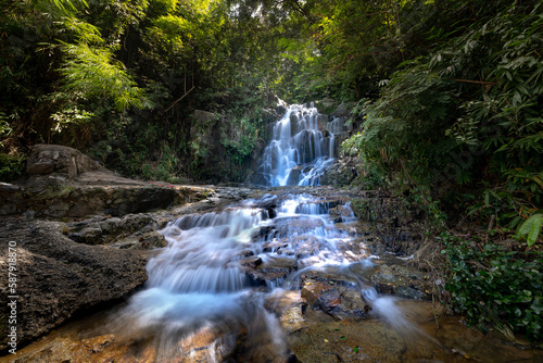 Stream flowing through rock crevices in the rainforest