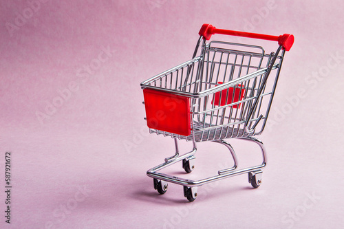 A Shopping Cart or trolly on pink background