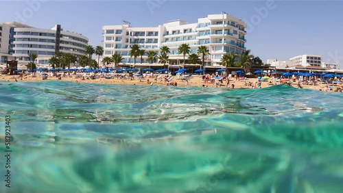 View of the beach and the line of hotels in Protaras Cyprus from the water level