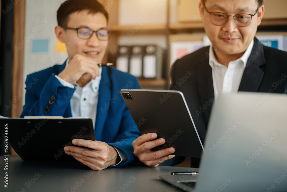 Business people making presentation with his colleagues and business tablet digital computer as meeting concept at office. Business people making presentation with his colleagues and business tablet digital computer as meeting concept at office.