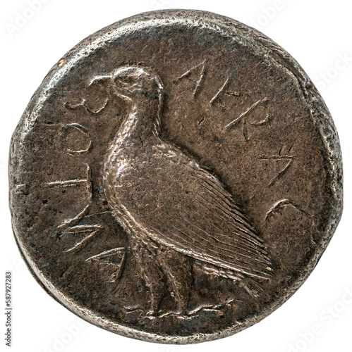 antike griechische Münze aus Agrigent: sitzender Adler im Profil