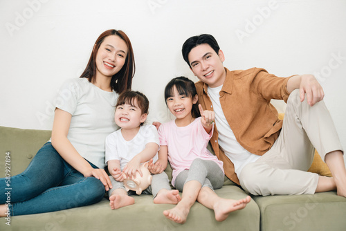 Young Asian family at home