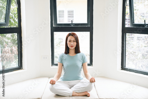 Free Download Young Asian woman at home - GFXLoad