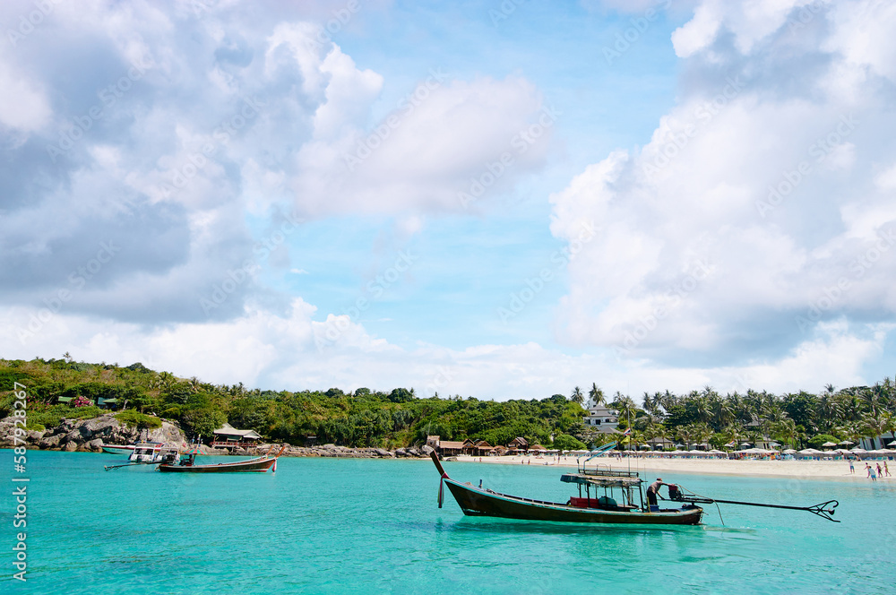 Vacation in paradise. Travel by Thailand. Beautiful landscape tropical beach with turquoise water and lontail boat.