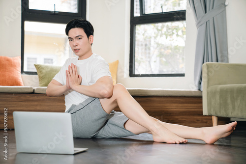 Young Asian man exercise at home