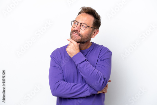 Middle age caucasian man isolated on white background looking up while smiling