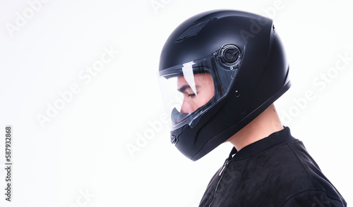 Image of young Asian man with helmet on background © Timeimage