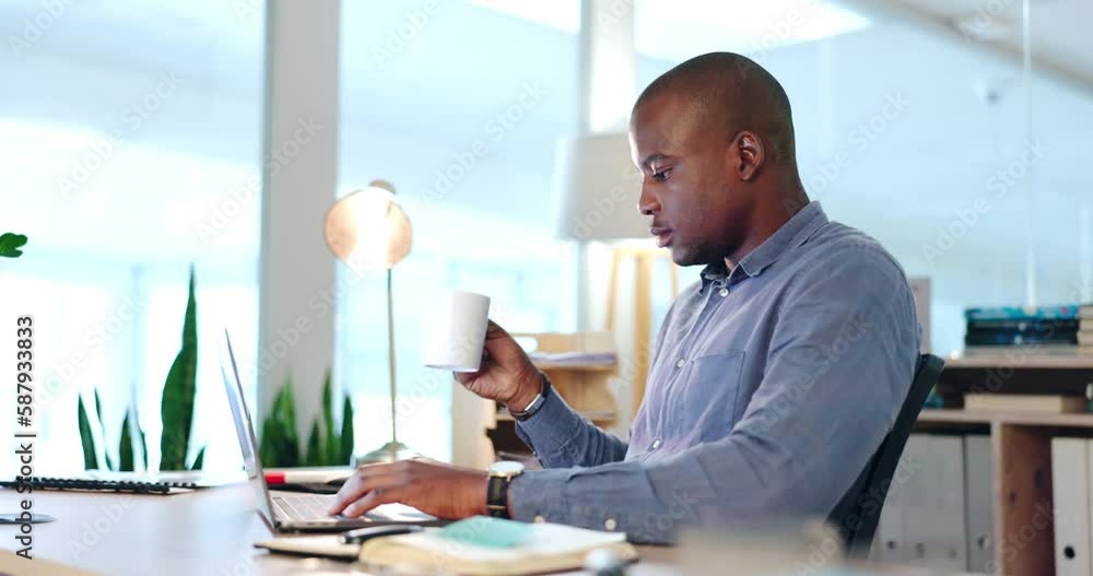 Business, black man and drinking coffee on laptop, typing online report and planning project at night. Serious male employee with cup of tea at computer, technology and review research data in office Business, black man and drinking coffee on laptop, typing online report and planning project at night. Serious male employee with cup of tea at computer, technology and review research data in office