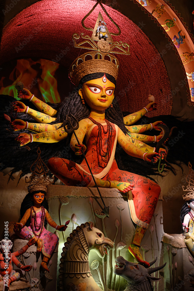 Idol of Goddess Devi Durga at a decorated puja pandal in Kolkata, West Bengal, India. Durga Puja is a famous and major religious festival of Hinduism that is celebrated throughout the world.