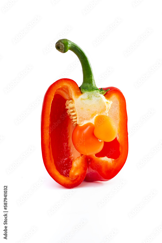 baby bell pepper inside a cross sectioned pepper, isolated baby bell pepper inside a cross sectioned pepper, isolated