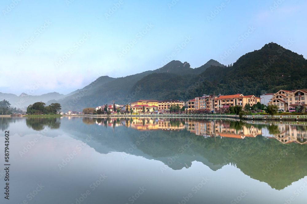 the beautiful reflection images in the center lake of Sa Pa town in the early morning. Sa Pa town is known as the best place for traveling