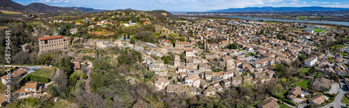 Aerial around the city Charmes-sur-Rhone in France on a sunny day in early spring. © Werner_Media
